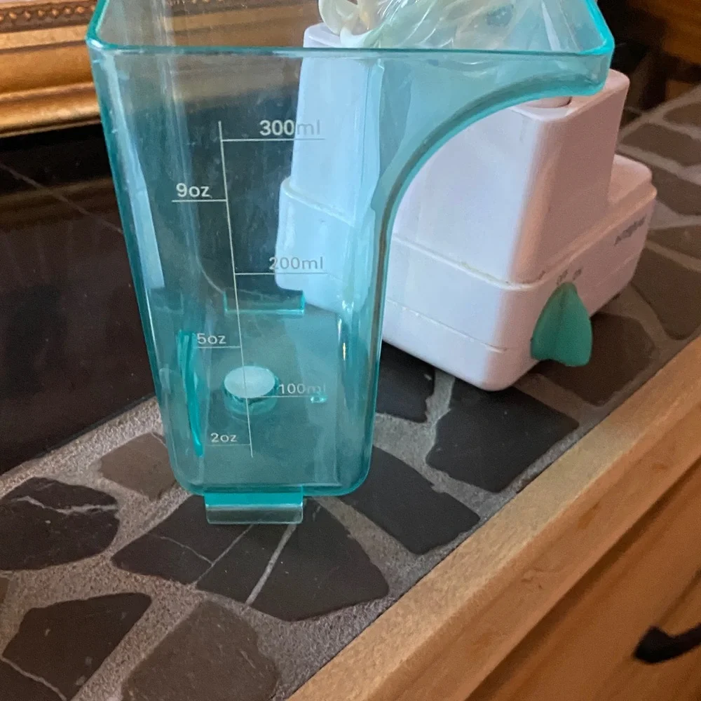 Electric Toothbrush with Aqua and White Design